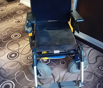 Электрическая инвалидная коляска.