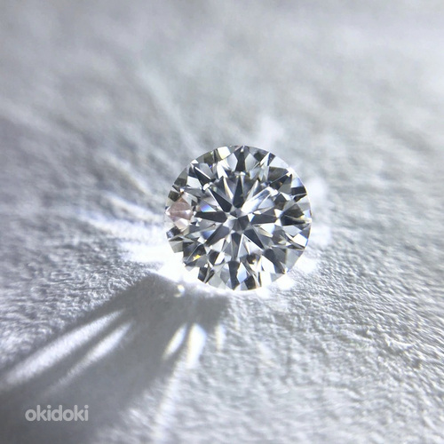 Обручальное кольцо с муассанитом и круглым бриллиантом 1 карат (фото #1)