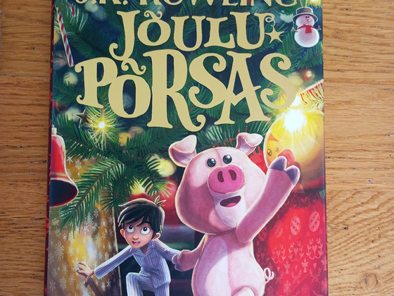 Jõulu põrsas raamat. Autor JK. Rowling.