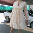Новое красивое бежевое платье с оборками и длинными рукавами (фото #1)