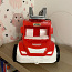 Детская игрушка в виде красной пожарной машины (фото #3)