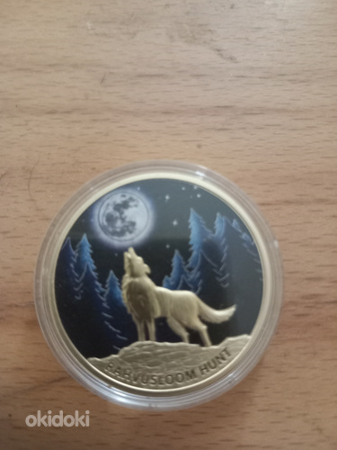 Золотая монета с изображением национального животного. (фото #1)