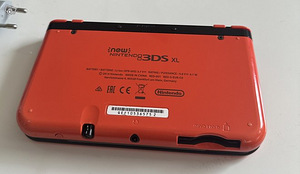 Новая Nintendo 3DS XL оранжево-черного цвета (3 фото из 3)